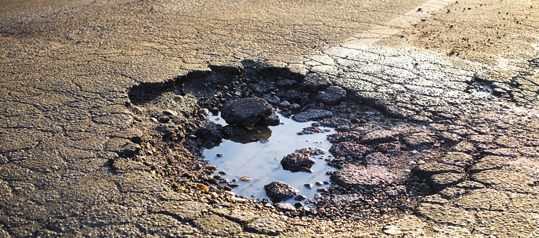 image showing pothole in road