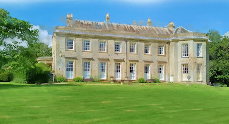 Conholt Park - a photo of a large stately home showing the grassy lawn and trees