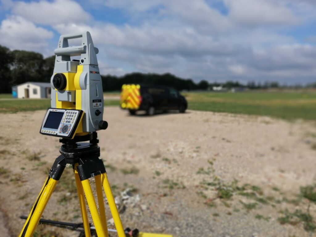 Geomax surveying total station visible with Van in the backdrop
